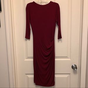 Elegant, maroon form fitting dress.